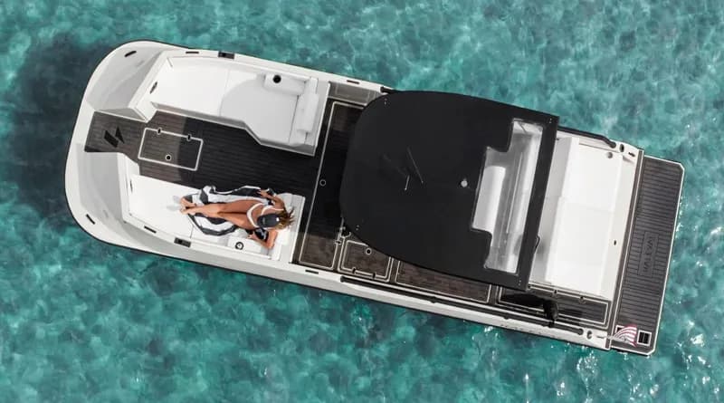 Halevai model2050 viewed from above, showing the full boat with open aft seating area and covered central section on turquoise water