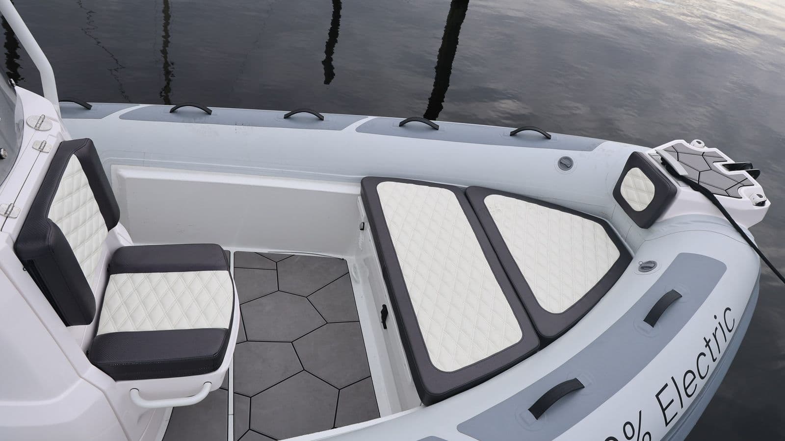 Highfield Sport 660 electric RIB, viewed from above, showing helm seating, bow cushions, and open deck.