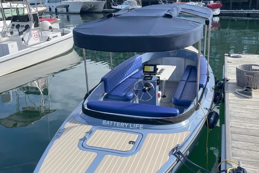 Vision Marine Fantail 217 seen from above at the stern, showing the covered cockpit, helm, seating, and foredeck.