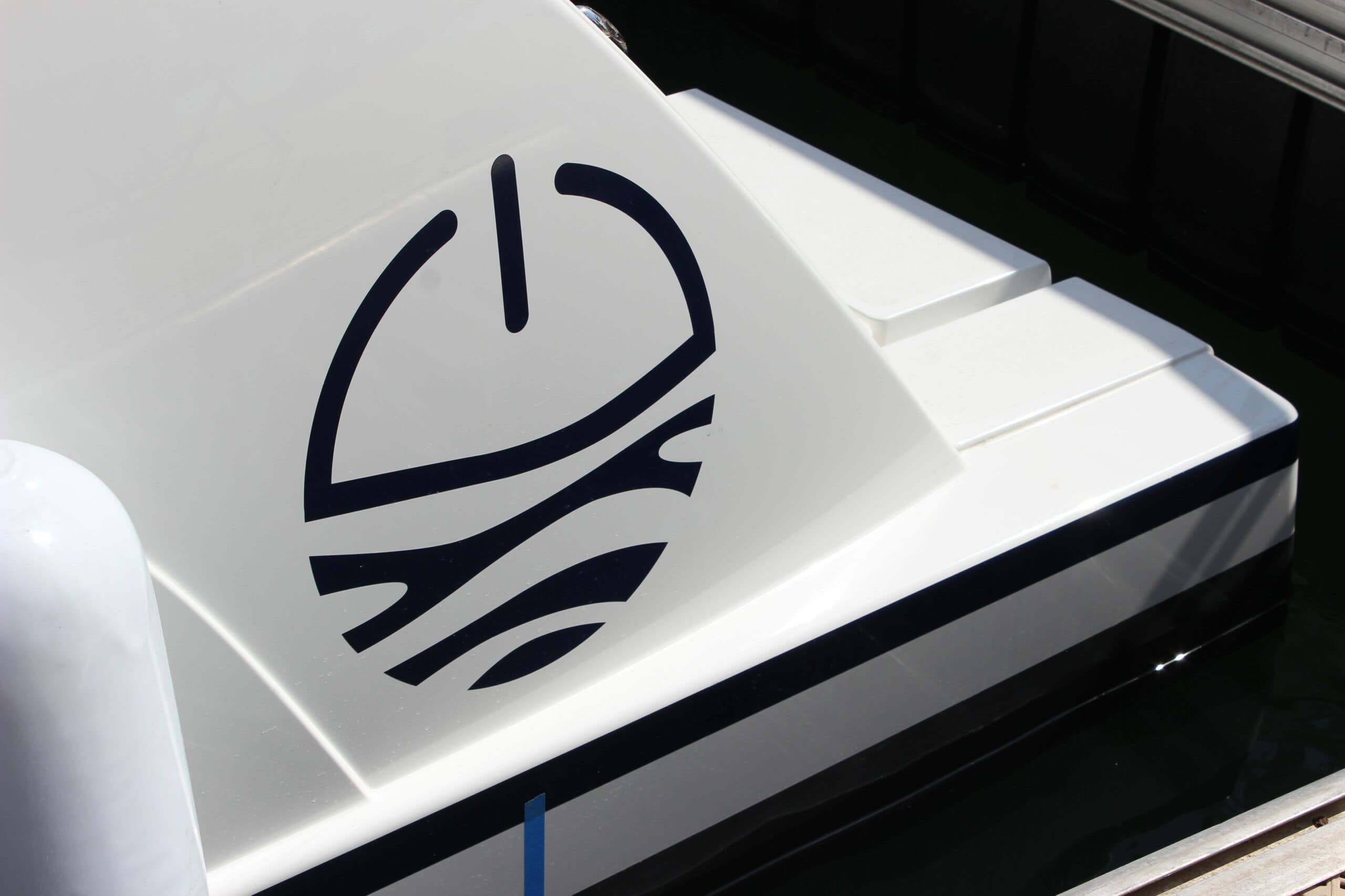 Millikan M10 stern deck with a black wave logo, viewed from the side.
