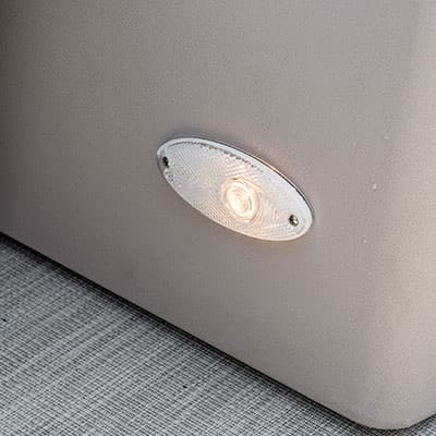 Oval light fixture mounted on a light-colored boat (2026 Princecraft Vectra 19 L) panel above textured flooring, viewed close up at an angle