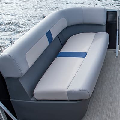 Rear corner bench seat and upholstered side of a pontoon boat (2026 Princecraft Jazz 17), viewed from above toward the stern.