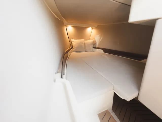 X Shore XS1 cabin berth with cushions, viewed from the entrance