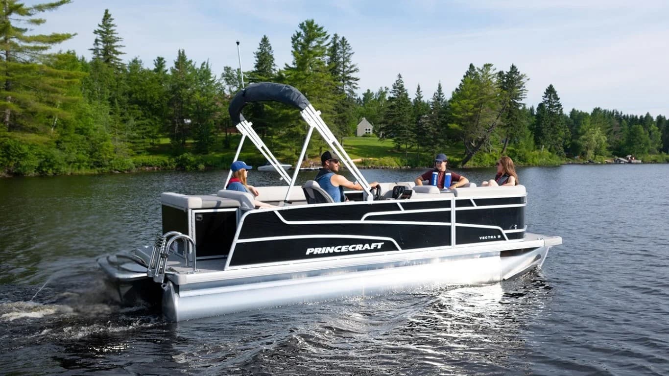 Princecraft Vectra 19 L pontoon boat cruising on a lake, viewed from the port side with the stern at left.