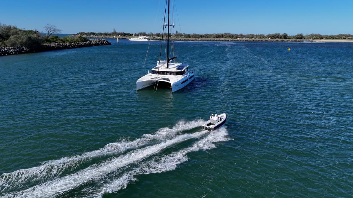 Offshore Cruising Tenders OC330 tender underway in a coastal waterway, viewed from above and behind.