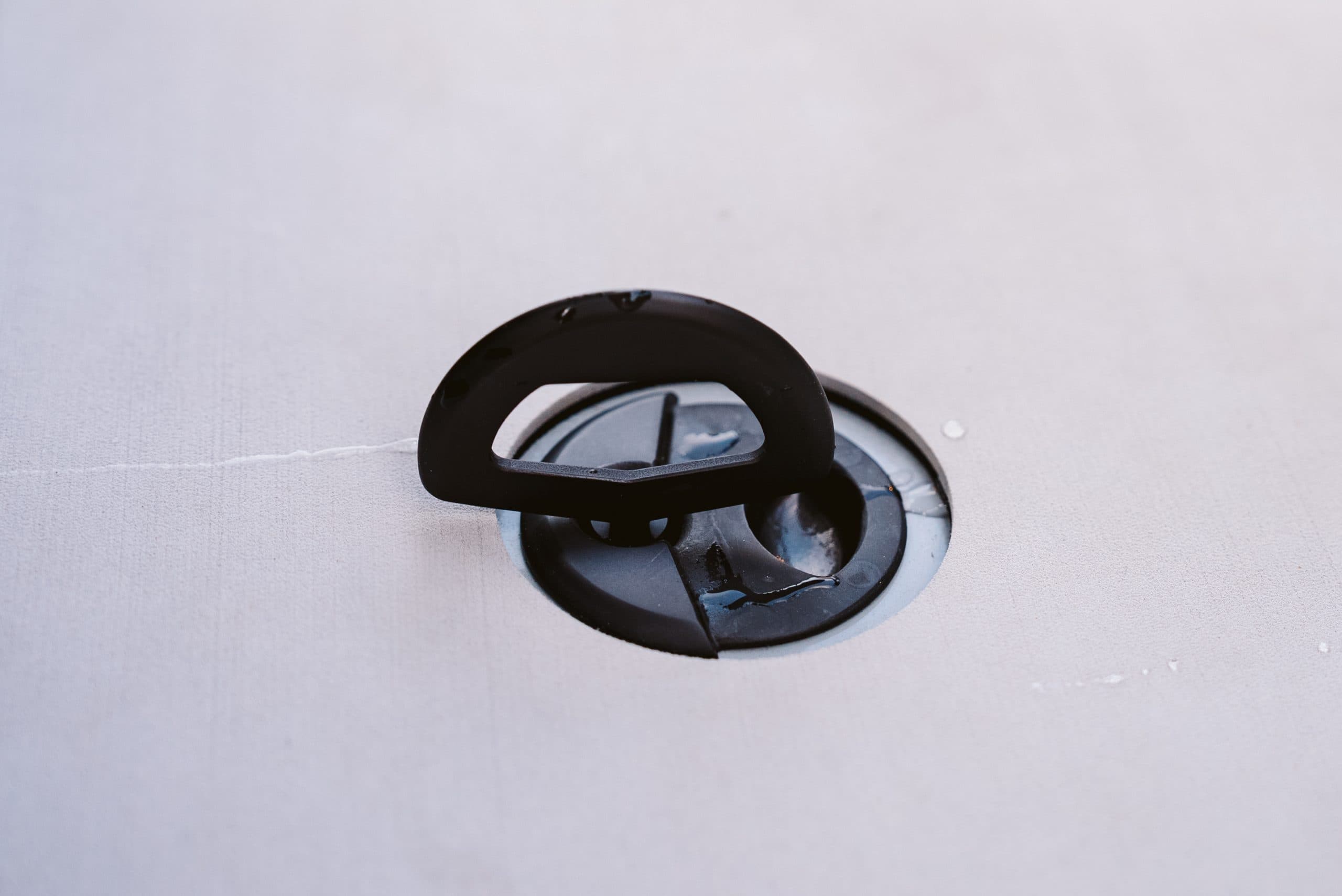 Turn-key handle on the Halevai model2050 deck, shown in close-up for access to a storage compartment