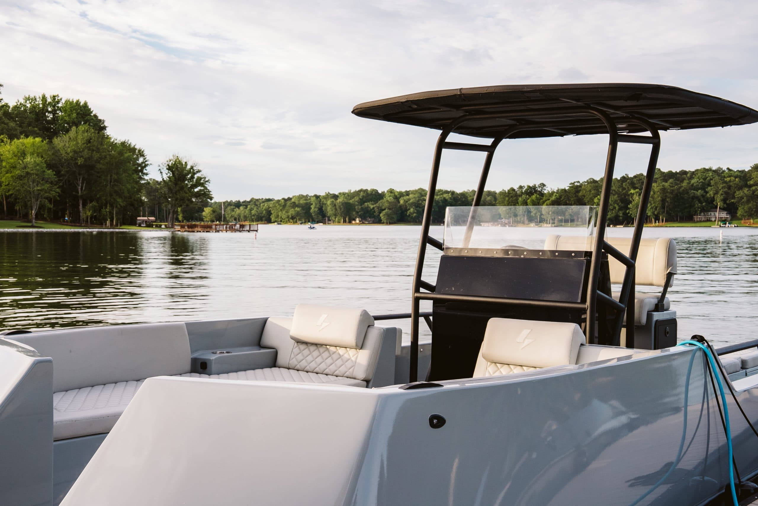 Halevai model2050 cockpit and helm viewed from the bow, with the lake visible beyond
