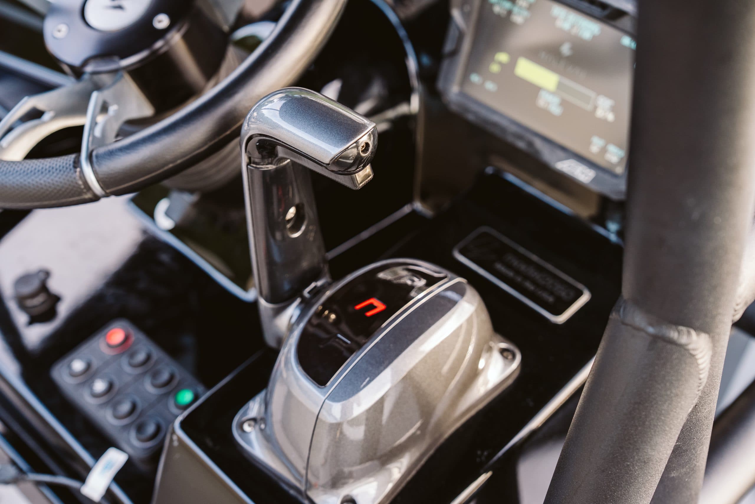 Close-up of a Halevai model2050 helm with steering wheel, electronic throttle control, dashboard display, and illuminated control panel.