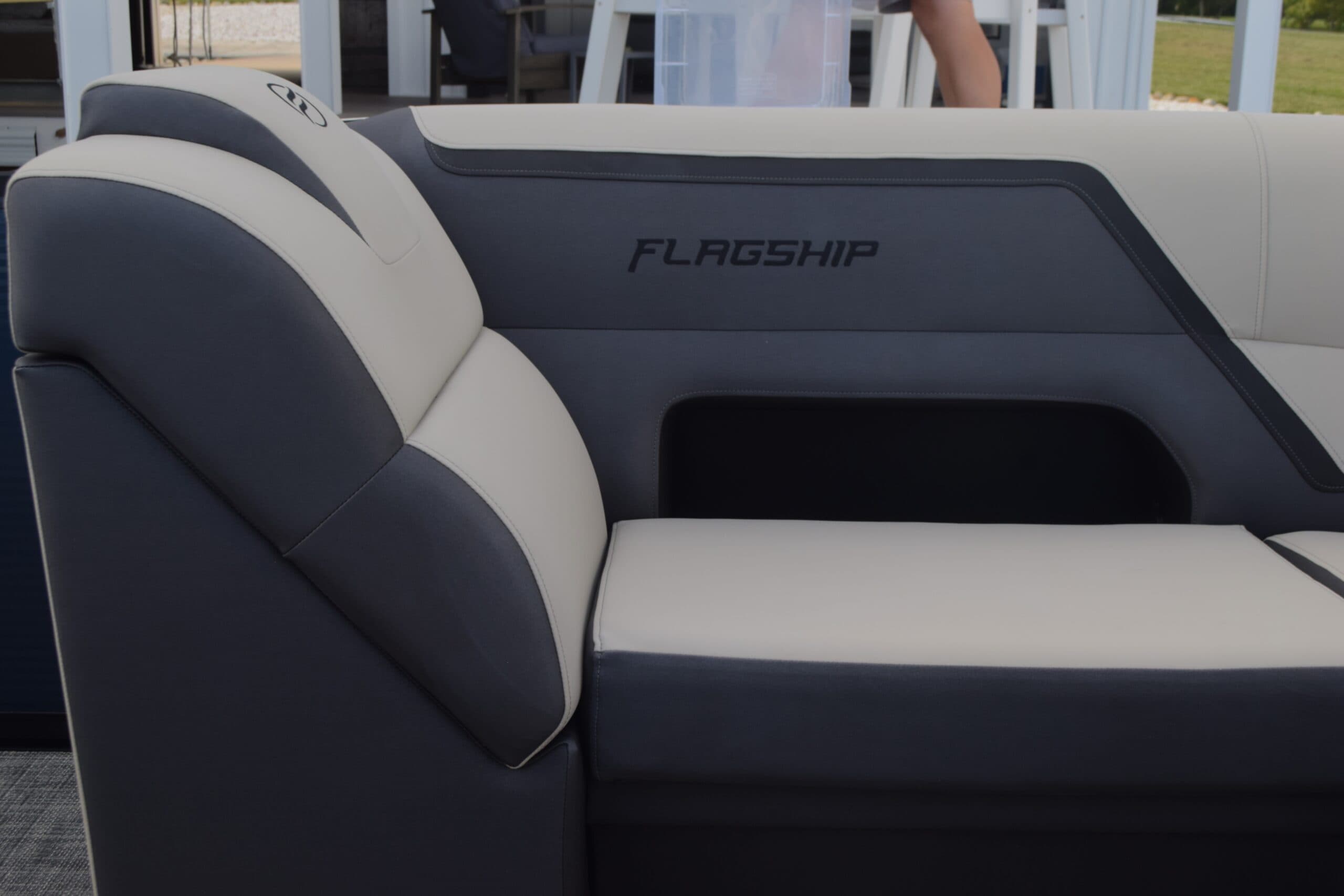 Flagship Discover seating close-up showing a cushioned side bench and backrest with Flagship branding.
