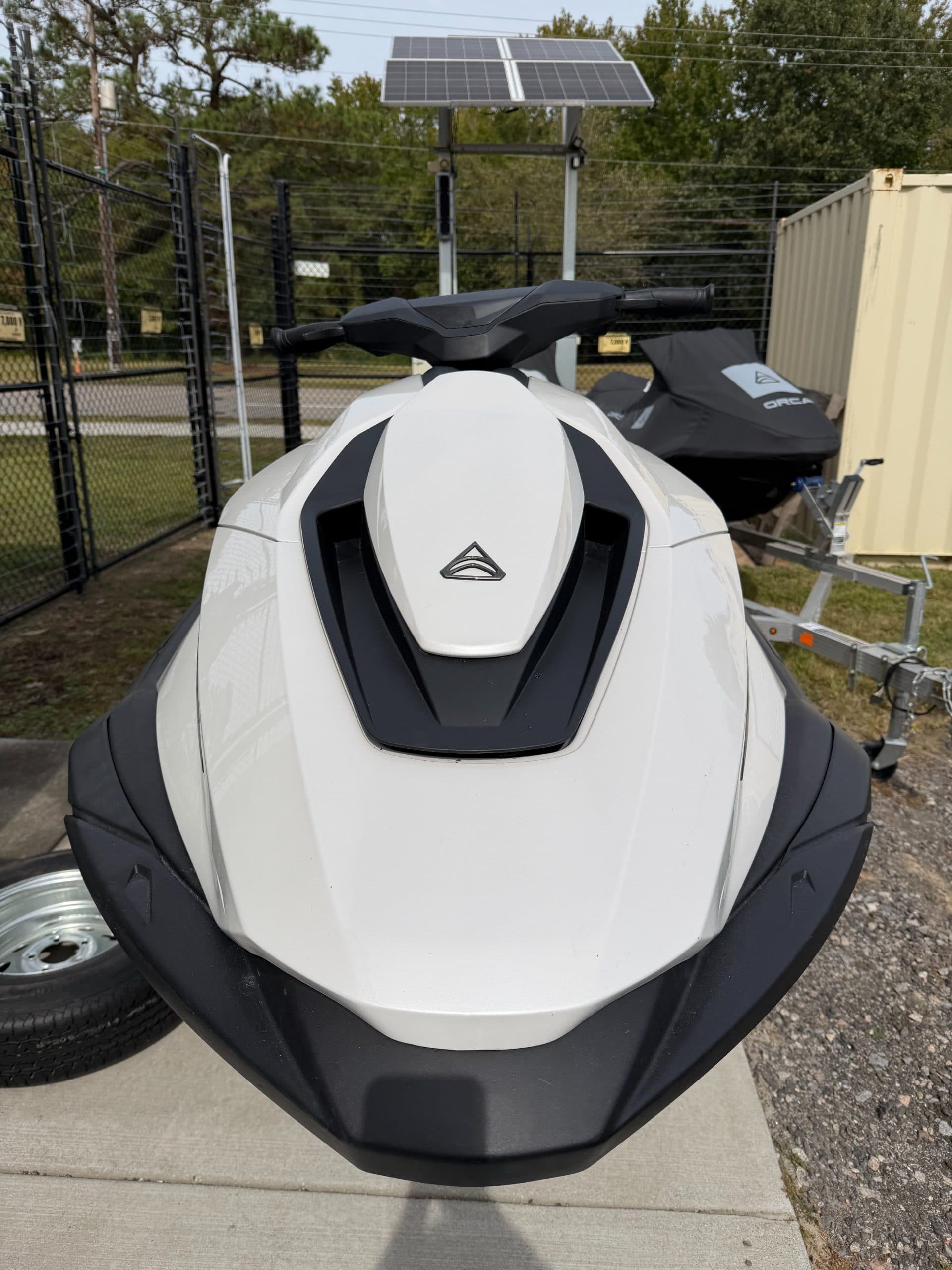 Front view of a white-and-black Taiga Orca personal watercraft on a trailer.
