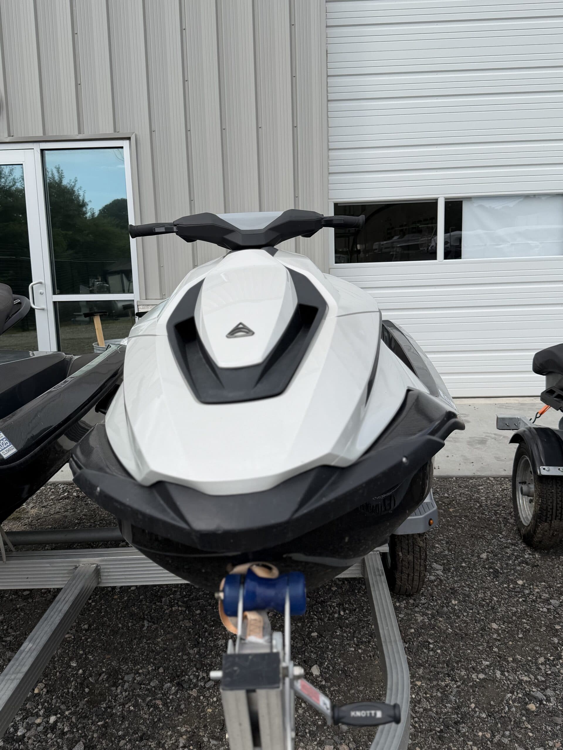 Front view of a white Taiga Orca personal watercraft on a trailer.