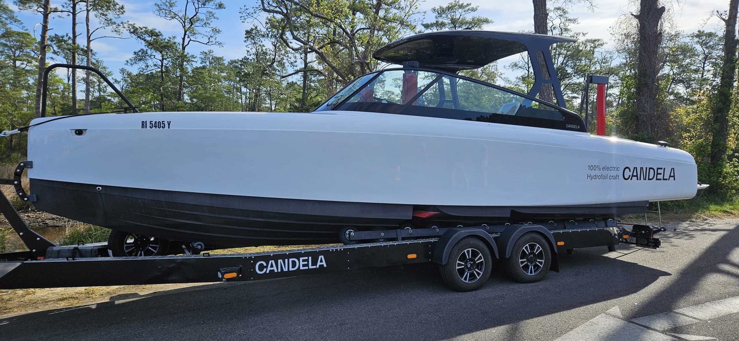 Candela C-8 on a dual-axle trailer, viewed from the side.