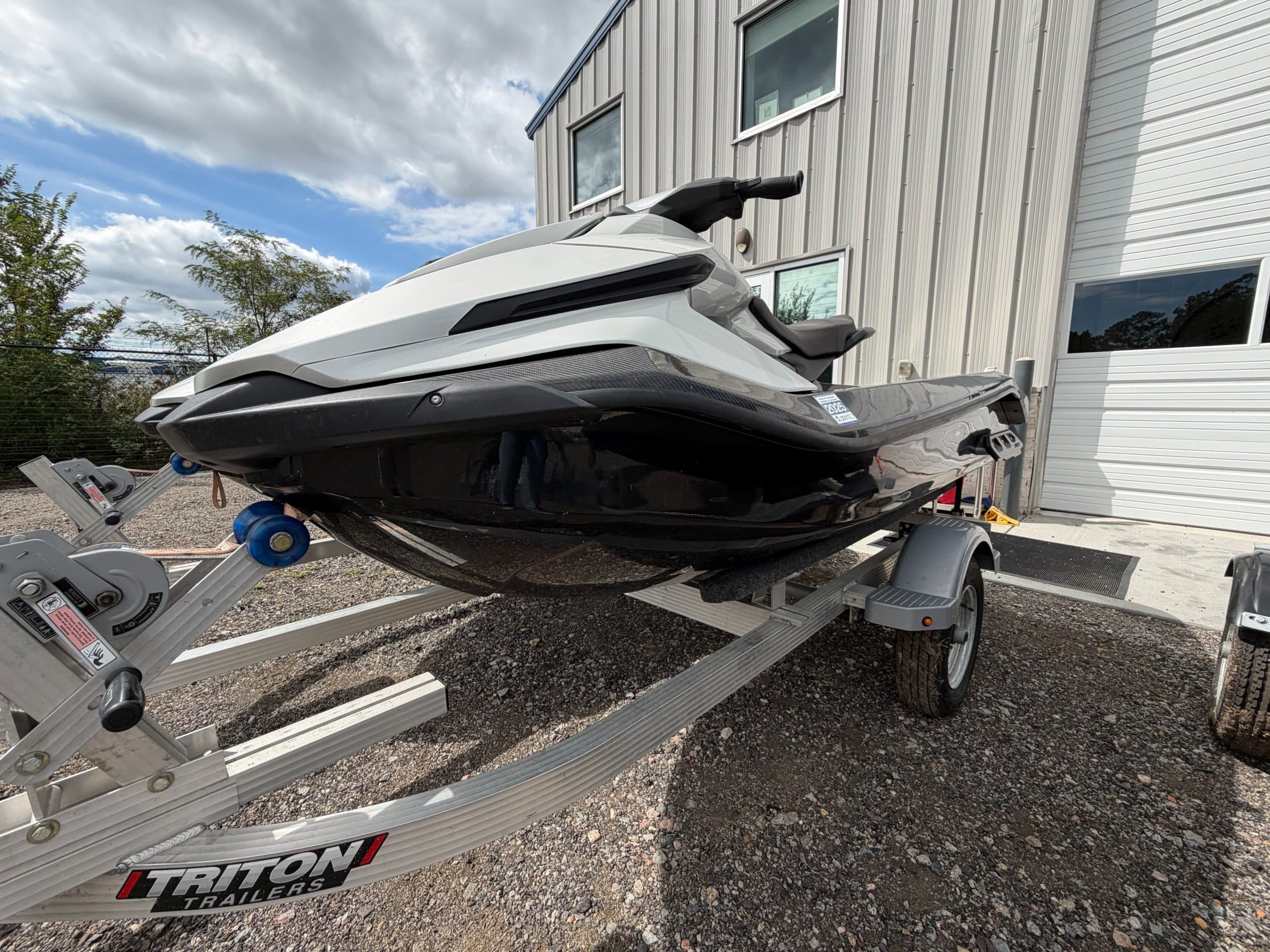 Taiga Orca Carbon personal watercraft on a trailer, viewed from the front-left side.