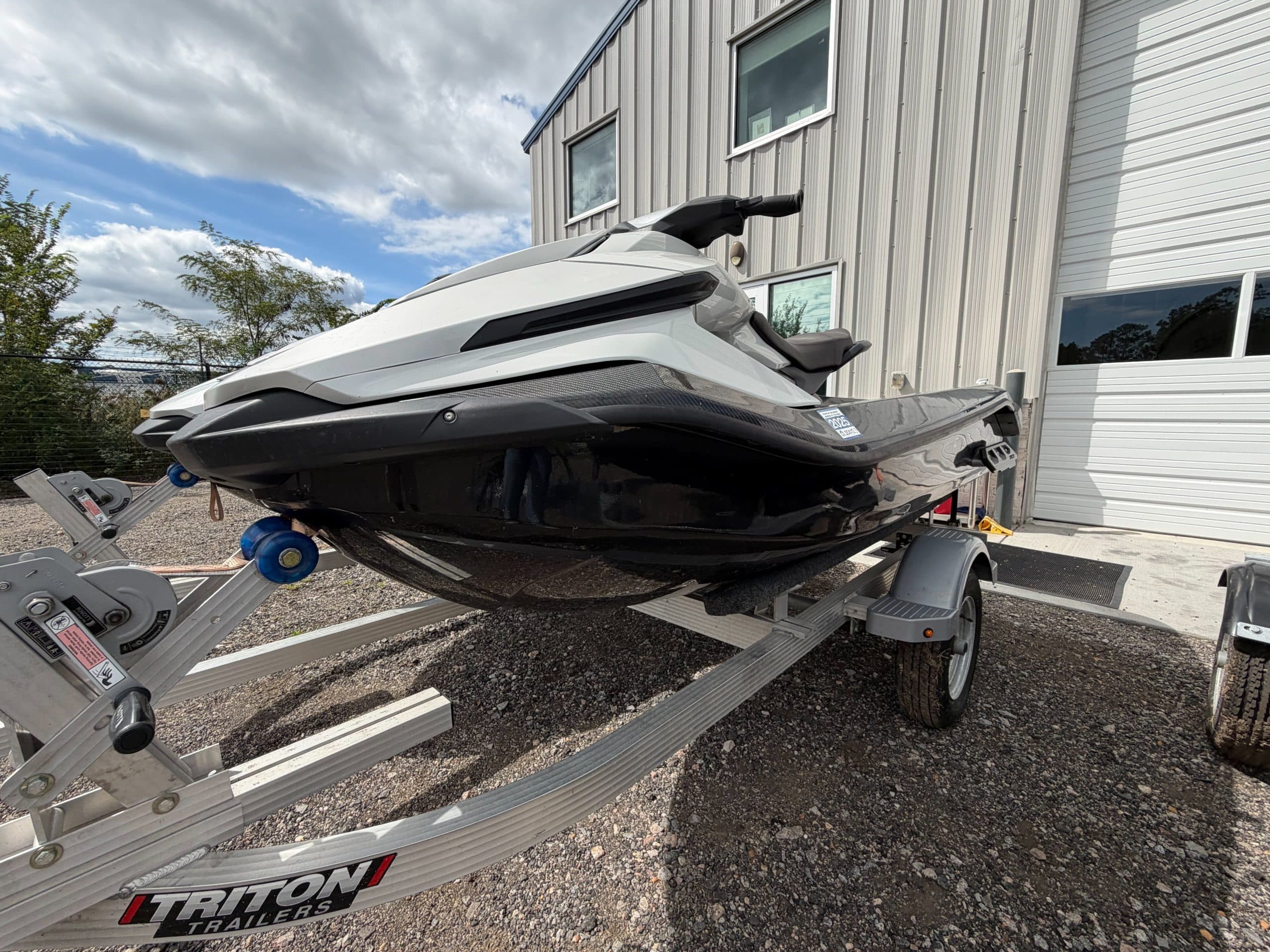 Taiga Orca Carbon personal watercraft on a trailer, viewed from the front-left side.