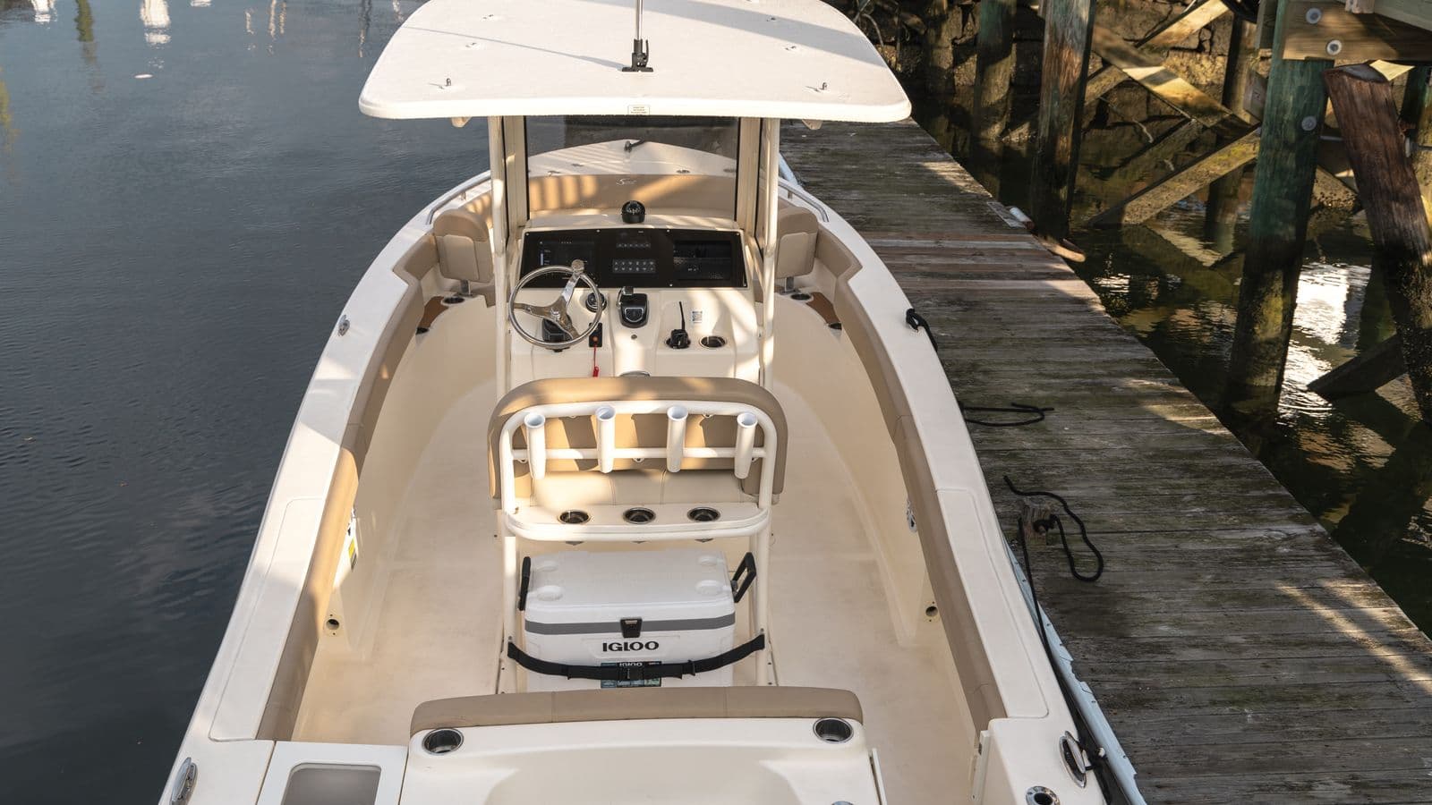 Scout 215 XSF cockpit and helm viewed from above, beside a dock.