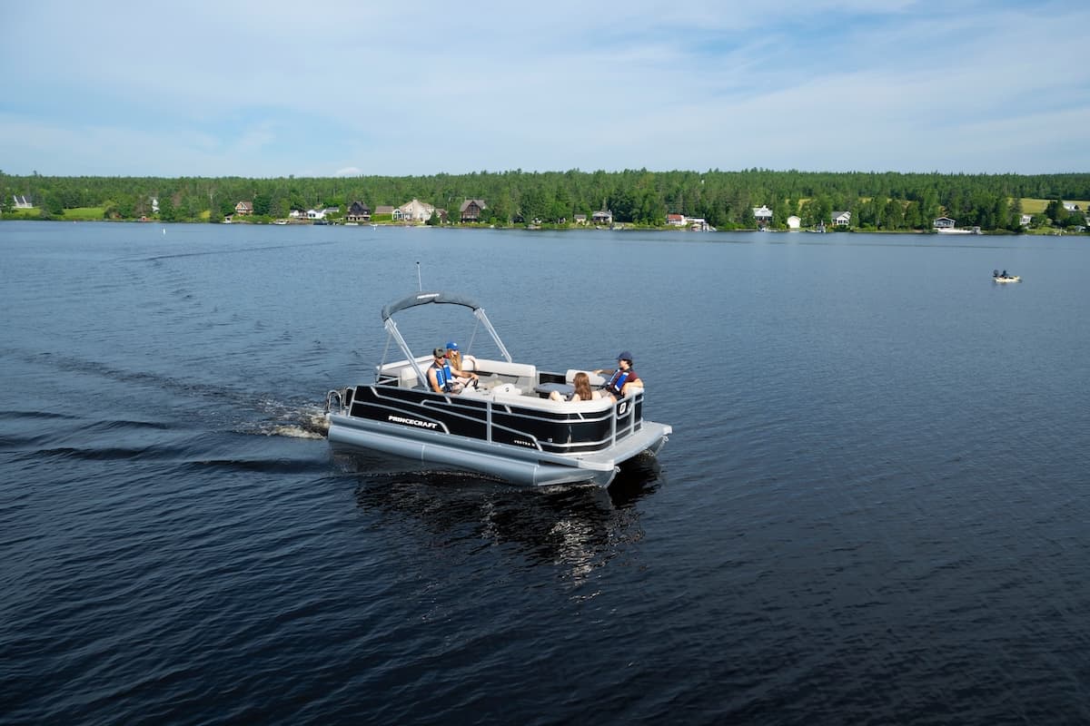 Princecraft Vectra 19 L pontoon boat cruising on a lake, viewed from above and to the side.