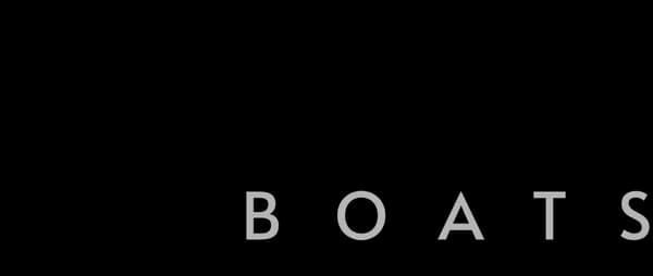 Close-up of partial white block lettering reading “BOATS” on a black background (2026 Voltaic AEW24).
