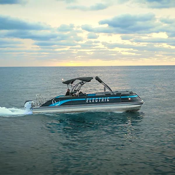 Vision Marine V30 cruising on open water, viewed from the side, with “ELECTRIC” visible on the hull.