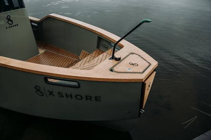 X Shore Eelex bow deck and open cockpit viewed from above, with X Shore branding visible.