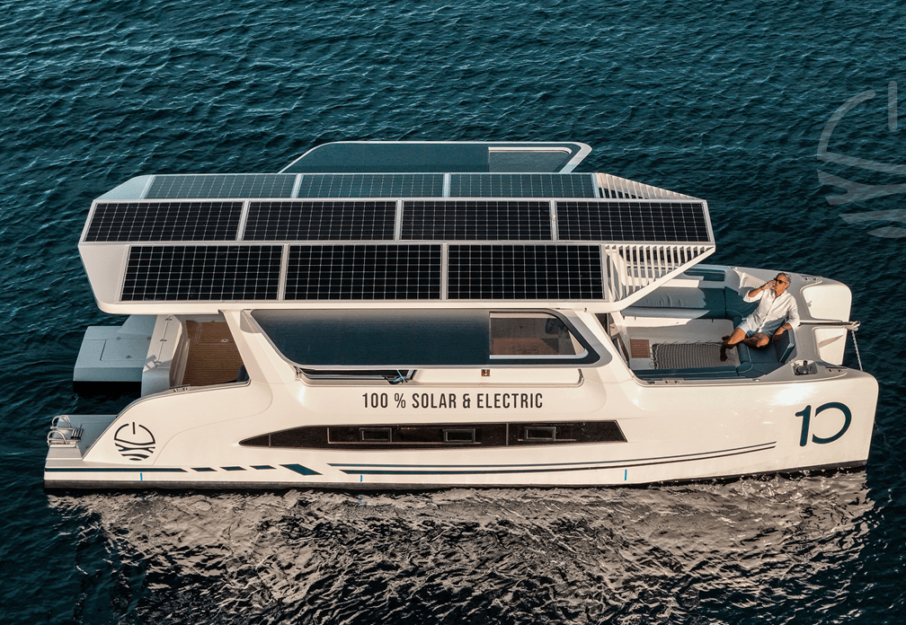 Millikan M10 viewed from above in profile on the water, with roof-mounted solar panels and “100% solar & electric” marking visible.